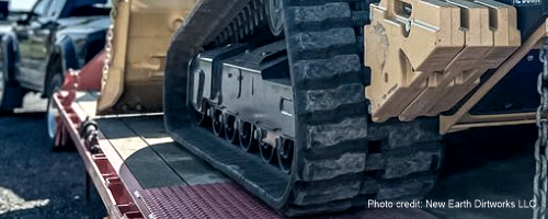 Track loader with rubber tracks